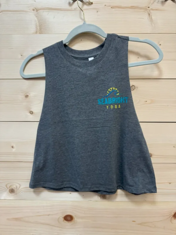 A gray tank top hanging on a rack.