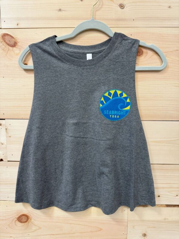 A gray tank top with a blue and yellow sun patch.